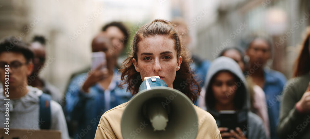 People on strike protesting with megaphone